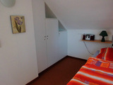 Ferienhaus in Mukran - Kunze - Schlafzimmer mit Bett und ausziehbaren Bett