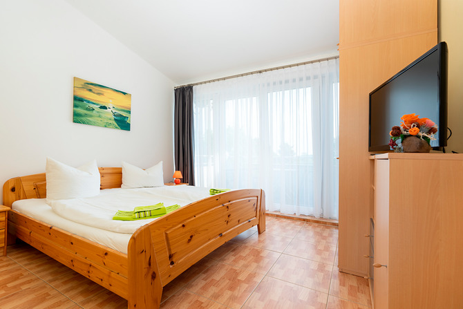 Ferienwohnung in Börgerende - Appartement 4 - Ostseeblick - Schlafzimmer mit Südbalkon