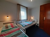 Ferienwohnung in Kellenhusen - Haus Schwoon - Schlafzimmer mit zwei Einzelbetten