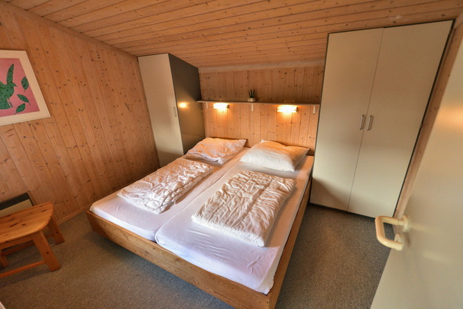 Ferienhaus in Pelzerhaken - Am Waldrand Haus B - Schlafzimmer mit Doppelbett