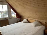 Ferienhaus in Kraksdorf - Ostseeblick - Erstes Schlafzimmer mit großem Doppelbett